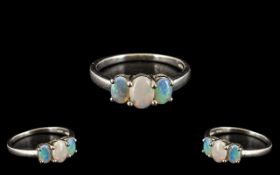 Ladies 3 Stone Set Opal Ring In Silver. Opals are of Good Size and Colour. Hallmarked for Silver.