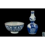 Blue & White Chinese Antique Decorated Bowl with a floral pattern painted to the body. 6" diameter.
