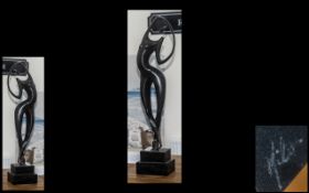 An Abstract Bronze Figure raised on a marble base. Signed Milo. Measures three feet in height.