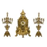 Large Italian Clock Garniture Of Baroque form Flanked by six-light candelabras,