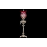 An Elegant Edwardian Silver Plated Oil Lamp in the French style with a finely cut glass font.