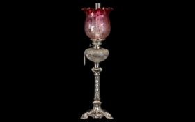 An Elegant Edwardian Silver Plated Oil Lamp in the French style with a finely cut glass font.