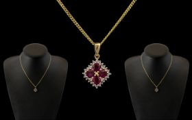 9ct Gold Attractive Ruby and Diamond Set Pendant - Attached to a 9ct Gold Chain.