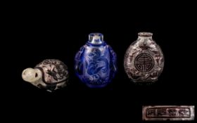Three Chinese Antique Cameo Cut Snuff Bottles, all signed and depicting dragons, birds, bats and