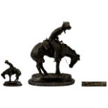 Fine Quality Green Patinated Bronze after Frederick Remington, depicting an American Cowboy riding