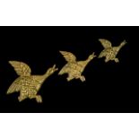 A Set of Three Antique Heavy Brass Wall Hanging Bird Figures. Measuring 11, 9 and 7 inches.
