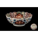 Meiji Period Lobed Shaped Imari Bowl of Typical Palette, with panels decorated with flowers and