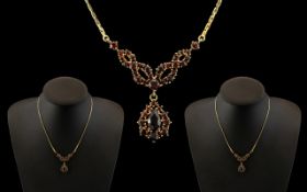 Ladies 9ct Gold - Attractive Garnet Set Necklace of Elegant Form / Design. Full Hallmark for 9.375.