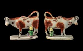 Matched Pair of Antique Staffordshire Cow Creamer Jugs, depicting a seated milkmaid milking a