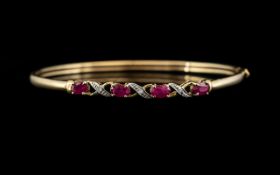 Ladies 9ct Gold Attractive Ruby and Diamond Set Hinged Bangle. Fully Hallmarked for 9ct.