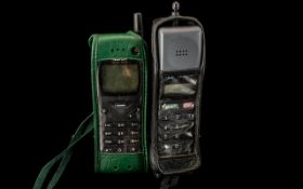 Two Vintage Cell Phones (Retro) - Nokia CM/H.333 in original leather cases.