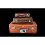 A Collection of Three Vintage Leather Suitcases comprising one tan case with Spartan plaque to