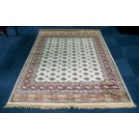 A Genuine Excellent Quality Cashmere Ivory Ground Carpet/Rug. Bukhara design. Measures 2.