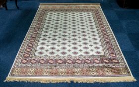 A Genuine Excellent Quality Cashmere Ivory Ground Carpet/Rug. Bukhara design. Measures 2.