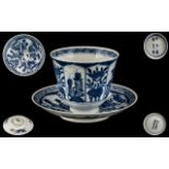 Antique Chinese Blue and White Decorated Tea Cup and Saucer, Depicting Flowers In Shaped Panels,