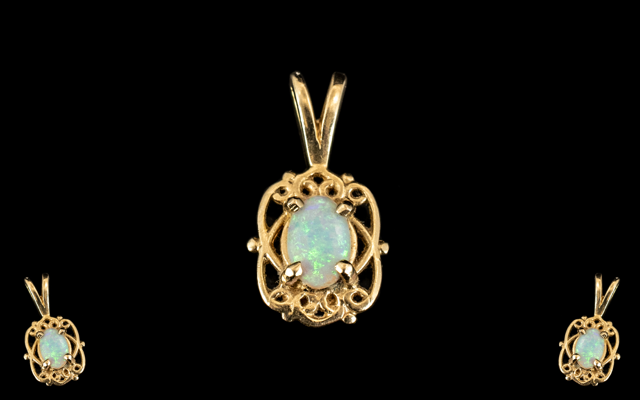 14ct Gold Opal Set Pendant. Lovely Design and Opal of Good Colour.