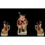 Antique Staffordshire Jug In The Shape of a Cavalier Wearing a Flam Buoyant Black Hat with a