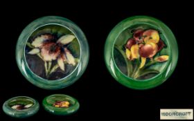 Moorcroft Two Small Circular Inverted Pin Dishes In ' Orchids and Lilies ' Design on Emerald Green