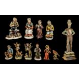 A Collection of Capodimonte Ornaments including an elderly lady picking carrots,