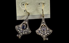A Pair of Antique Style Sapphire and Drop Earrings central sapphire surrounded by small round cut