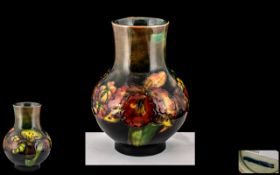 Moorcroft - Tube lined Flambe Bulbous Shaped Vase ' Orchid ' Design.