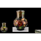 Moorcroft - Tube lined Flambe Bulbous Shaped Vase ' Orchid ' Design.