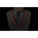 A Modern Cherry Amber Coloured Necklace.