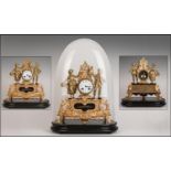 Antique French Gilt Metal Mantle Clock under a glass dome. The central clock flanked by a loving
