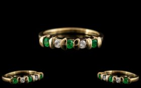 Ladies Contemporary and Attractive 9ct Yellow Gold, Diamond and Emerald Set Ring.