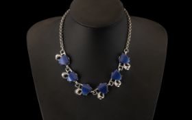 Lisner Elaborate Vintage Design Necklace in blue lucite shapes, set into shaped silver plated