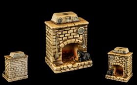 Vintage Porcelain Ashtray in the form of a fireplace with a cat sitting in the hearth.