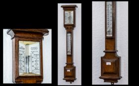 A Late Victorian Oak Stick Barometer makers Adie, Broadway Works, Westminster.