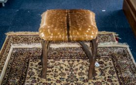 A Stool Shaped from Antlers with a squared top seat.