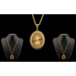 Attractive 9ct Gold Oval Shaped Hinged Locket with Diamond Cut Star burst Design to Front Cover,