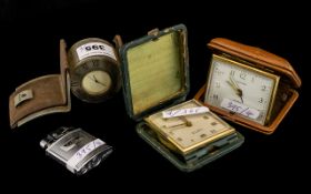 Two Leather Boxed Travelling Clocks with a Metal Designer Mantle Clock Presented by the Emirates