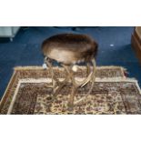 A Stool Shaped from Antlers with a pony skin top seat. Early 20th Century.