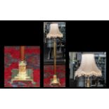 Brass Corinthian Column Standard Lamp with extension on a square step base terminating in poor feet