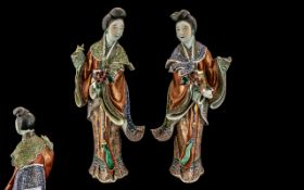 Pair of Chinese Antique Famile Rose Figures of Maidens Holding Lotus Blossoms,