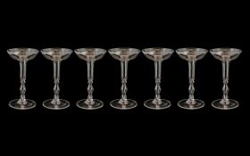 Set of 7 Glass Champagne Flutes of Unusual Form. 6 Inches High.