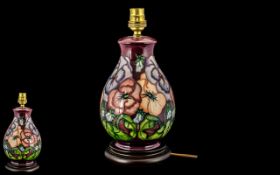 Moorcroft - Modern Tube lined Lamp Base ' Pansy ' Design on Wine Ground. Designer Albert Moorcroft.