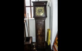 An Antique Grandfather Clock with a thirty hour brass square dial engraved with makers name Joseph