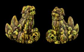 Pair of Antique Chinese Foo Temple Dogs, with an unusual yellow and green splash glaze. Both dogs