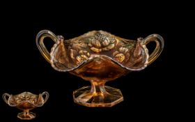 Fenton Carnival Glass Footed Bowl with handles and moulded rose decoration,