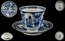 Antique Chinese Blue and White Decorated Tea Cup and Saucer, Depicting Flowers In Shaped Panels,