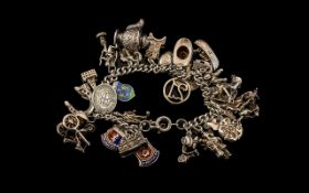 Silver Charm Bracelet - Loaded with Lots of Interesting Charms. 66 grams. Please See Photo.