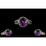 Ladies - Attractive 9ct White Gold Amethyst and Diamond Set Dress Ring. The Central Faceted Amethyst