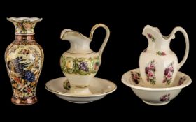 Two Decorative Ceramic Water Jug and Bowl Sets comprising one of Portugese origin, floral decoration