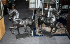 Pair of Large Cast Bronze Stylised Horses wearing decorative Oriental saddles with adornments; the