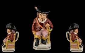 Antique Staffordshire Jug In The Shape of a Cavalier Wearing a Flamboyant Black Hat with a