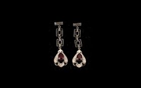 Pair of Ruby Art Deco Style Drop Earrings, an elegant pair of earrings with pear drop pendants,